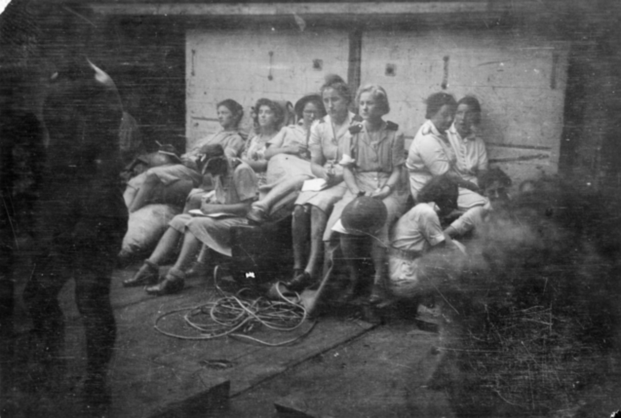 Nurses and physiotherapists in air raid shelter in the hold of the Empire Star following Singapore evacuation, February-March 1942