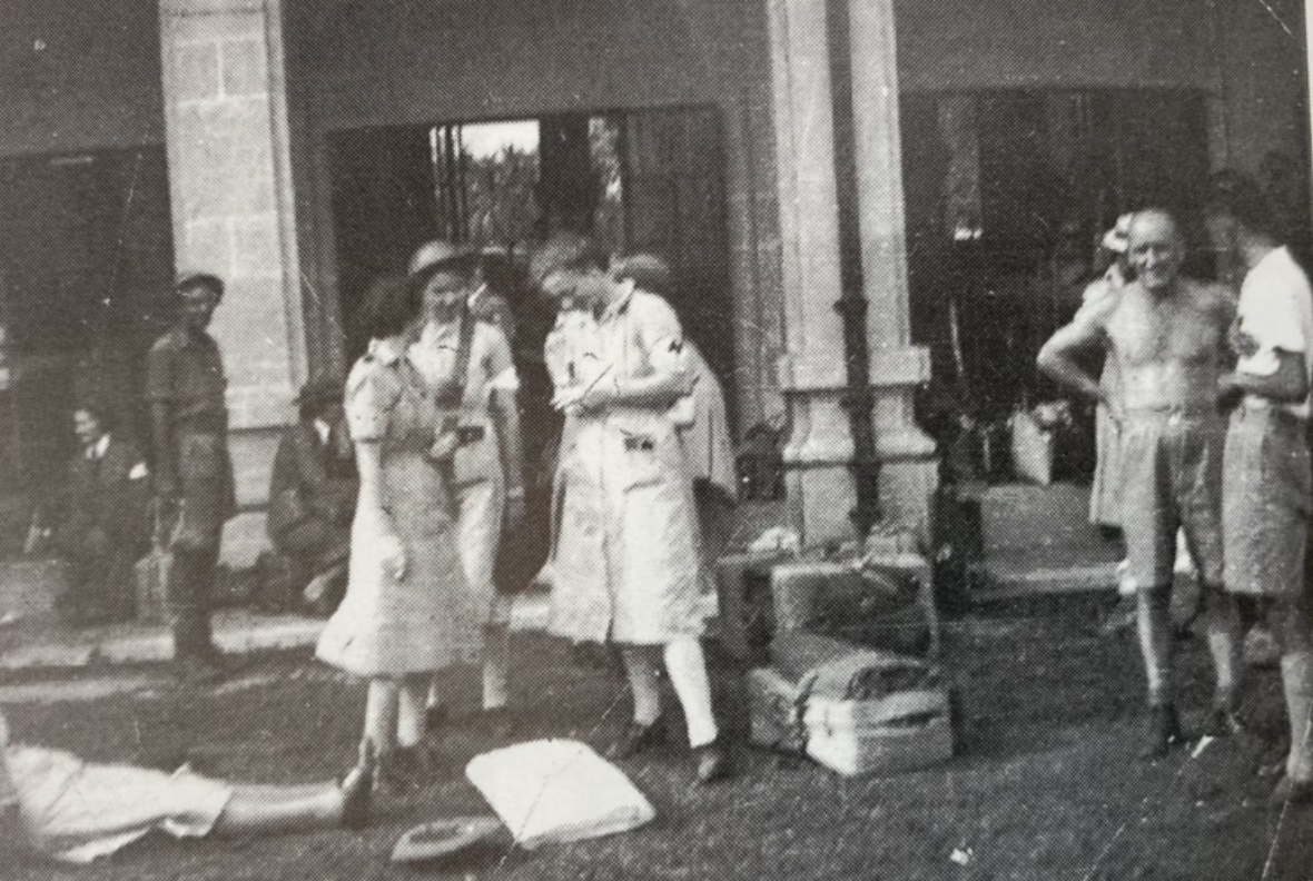 Audrey Simpson and Cynthia Sutton talking with a nurse on the last day at St Patricks School, Singapore.